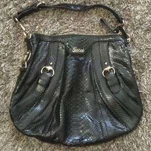 Dark green, snakeskin Gucci hobo purse.